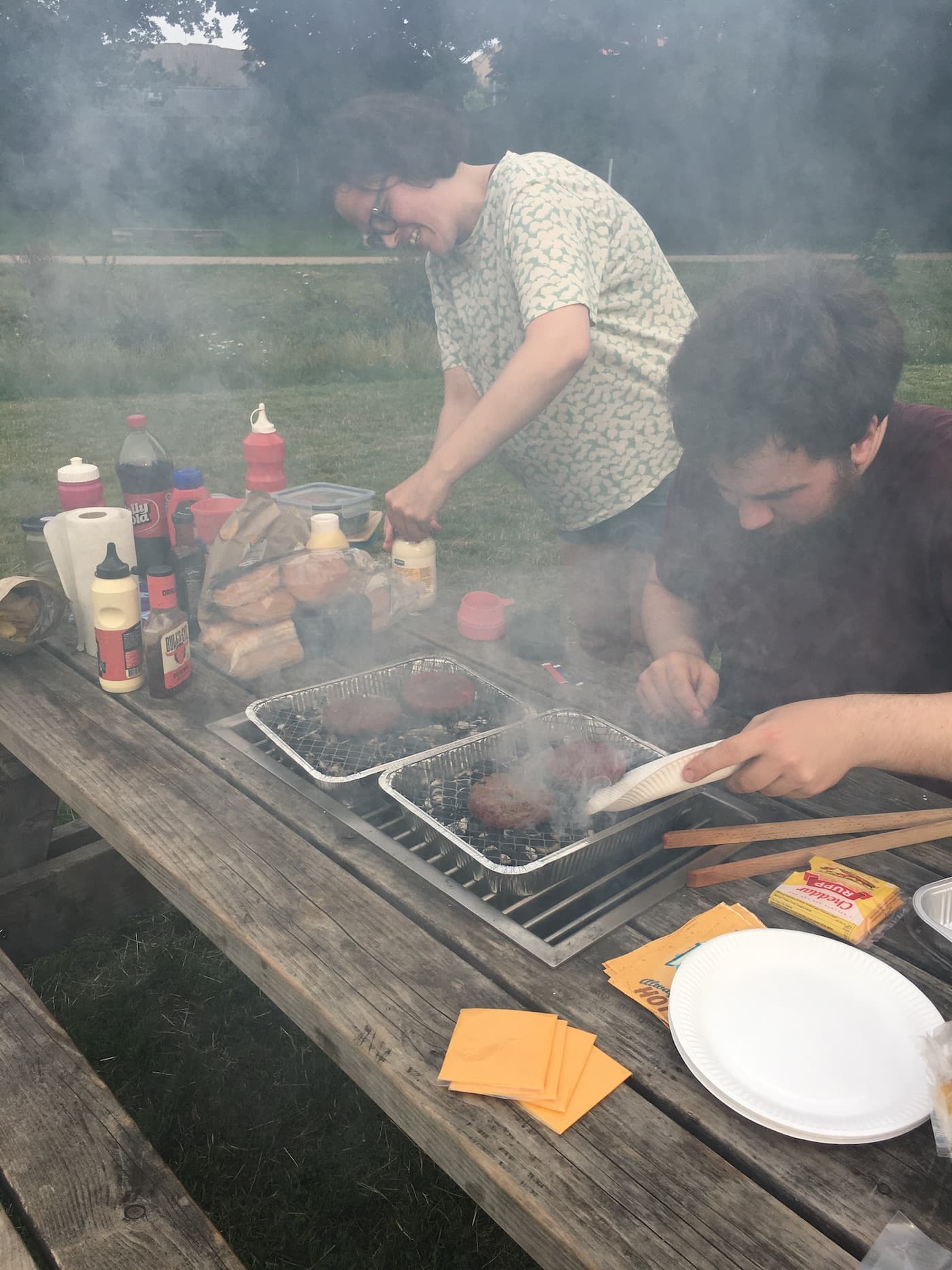 Ditte Johansen and Rasmus preparing bbq