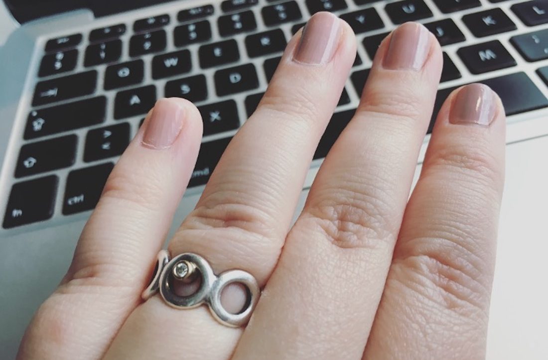 laptop, nail varnish and jewelry