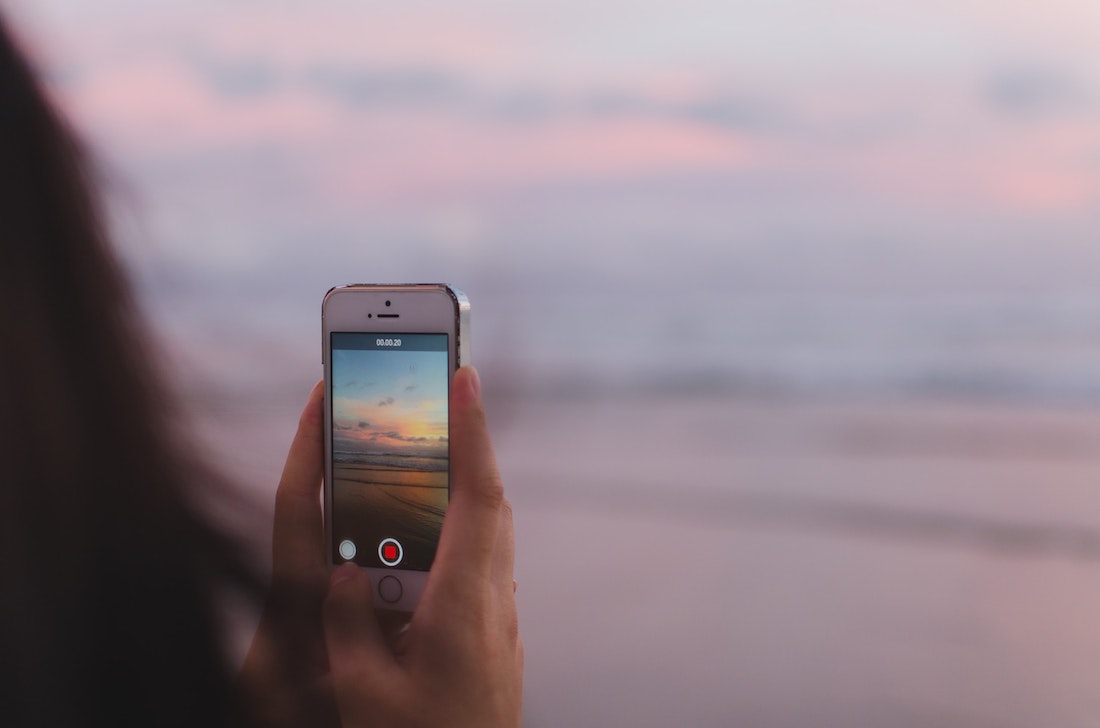 Girl holding phone filming