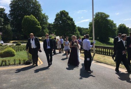 matt walking in the sun outside at kath and scotts wedding