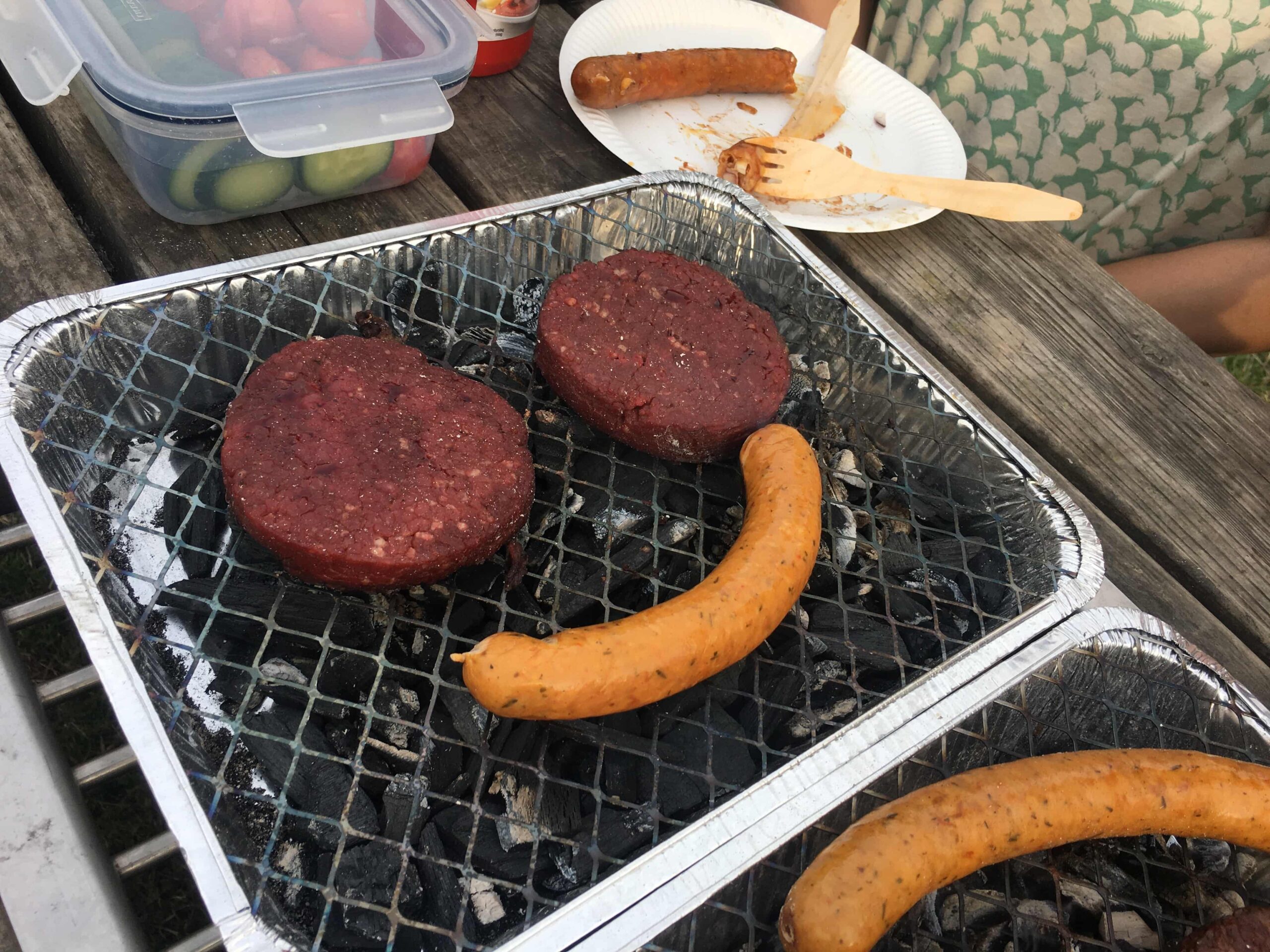 burger patty and sausage smiley on bbq