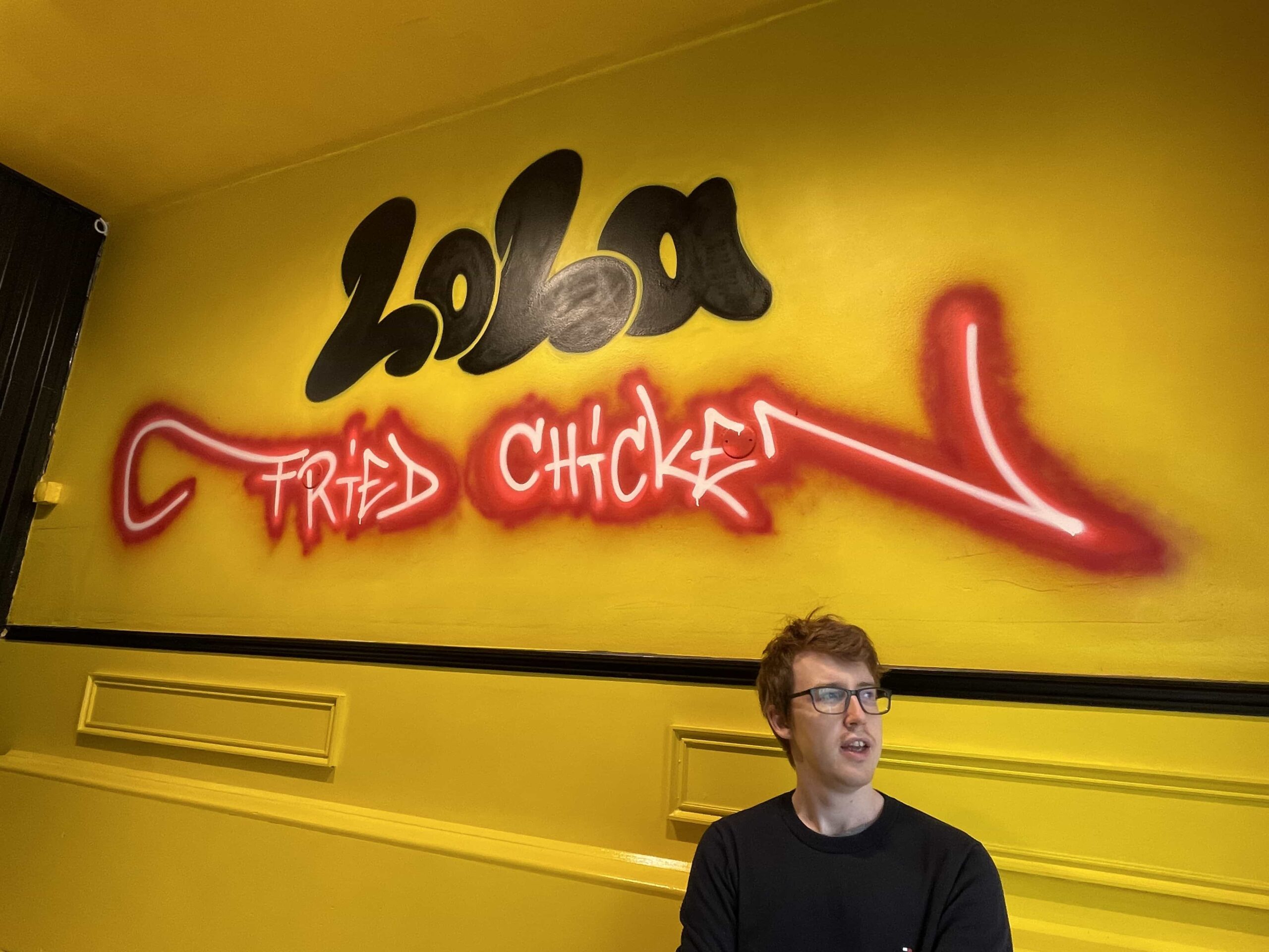 lola fried chicken on the wall