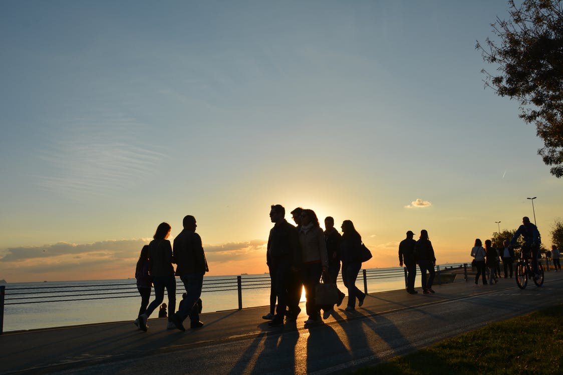 People walking near ocean